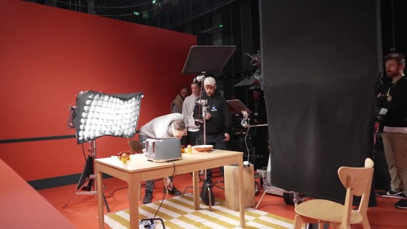 Crew lighting the orange kitchen set on the Silentnight shoot